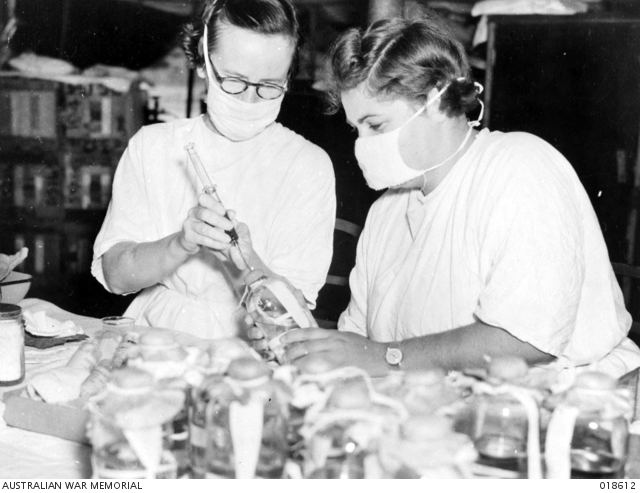 Sisters M. McAulay and G. Park preparing liquid penicillin in an Australian General Hospital laboratory.
